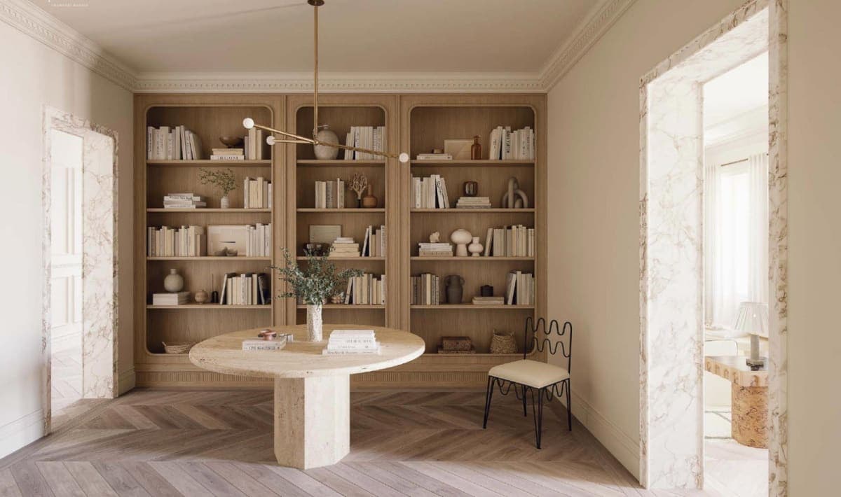 Biblioteca con mesa de travertino y marcos de mármol en piso de obra nueva en el barrio de Almagro, Madrid — Coco House